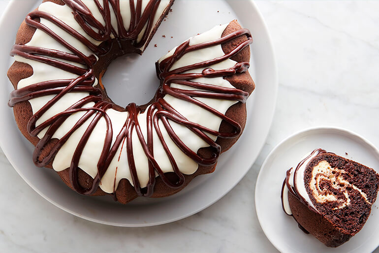 Chocolate cake with white icing and chocolate bitumen