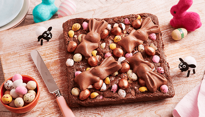 a delicious chocolate brownie topped with colorful mini easter eggs